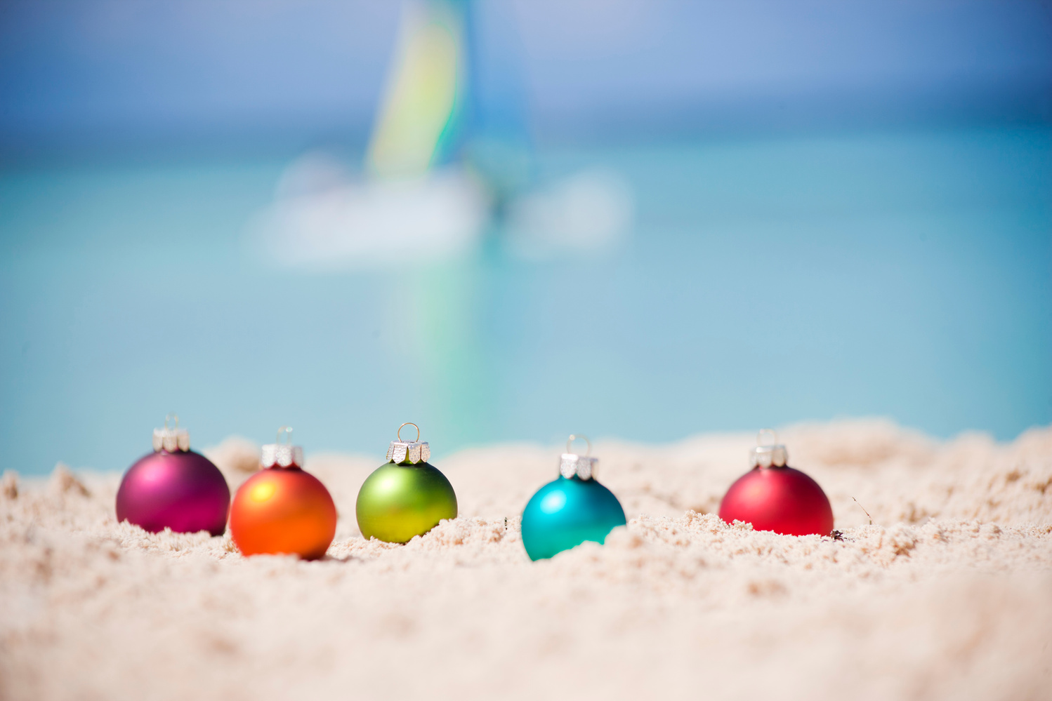 Christmas baubles at tropical beach